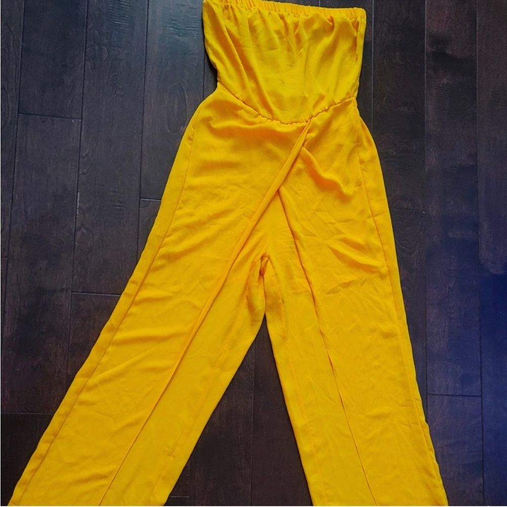 Yellow Romper by New York & Company. Semi-sheer with shirts underneath.